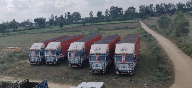 Aerial view of JSM red trucks staged for a regional run
